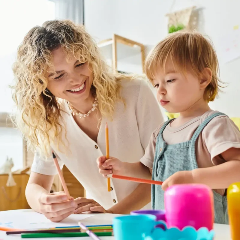 a childcare educator with a child