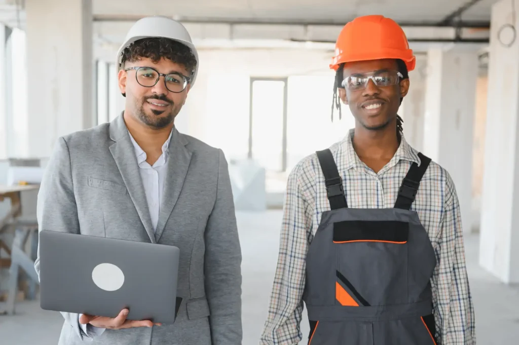 A health and safety inspector with a construction worker